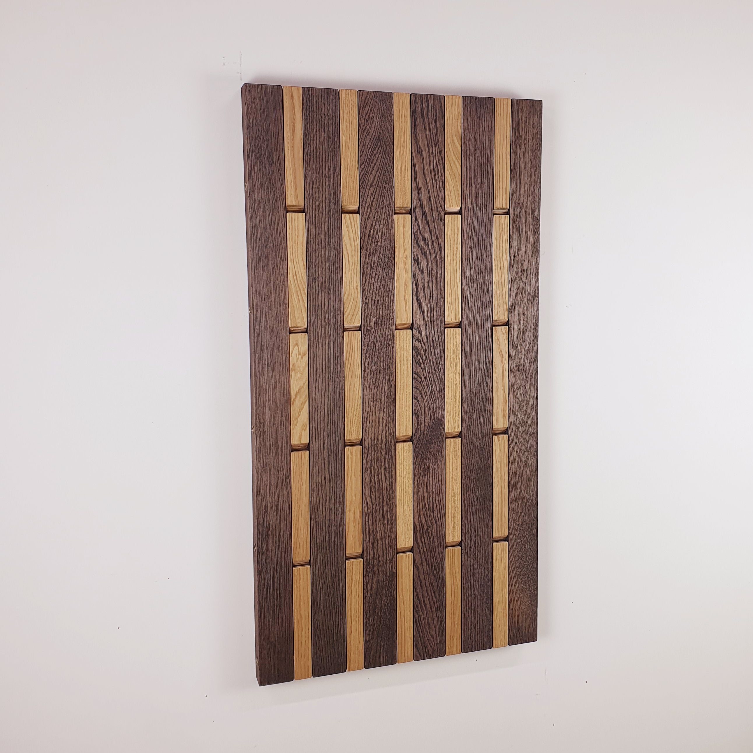 Wall-mounted organizer. light and dark. plywood oak