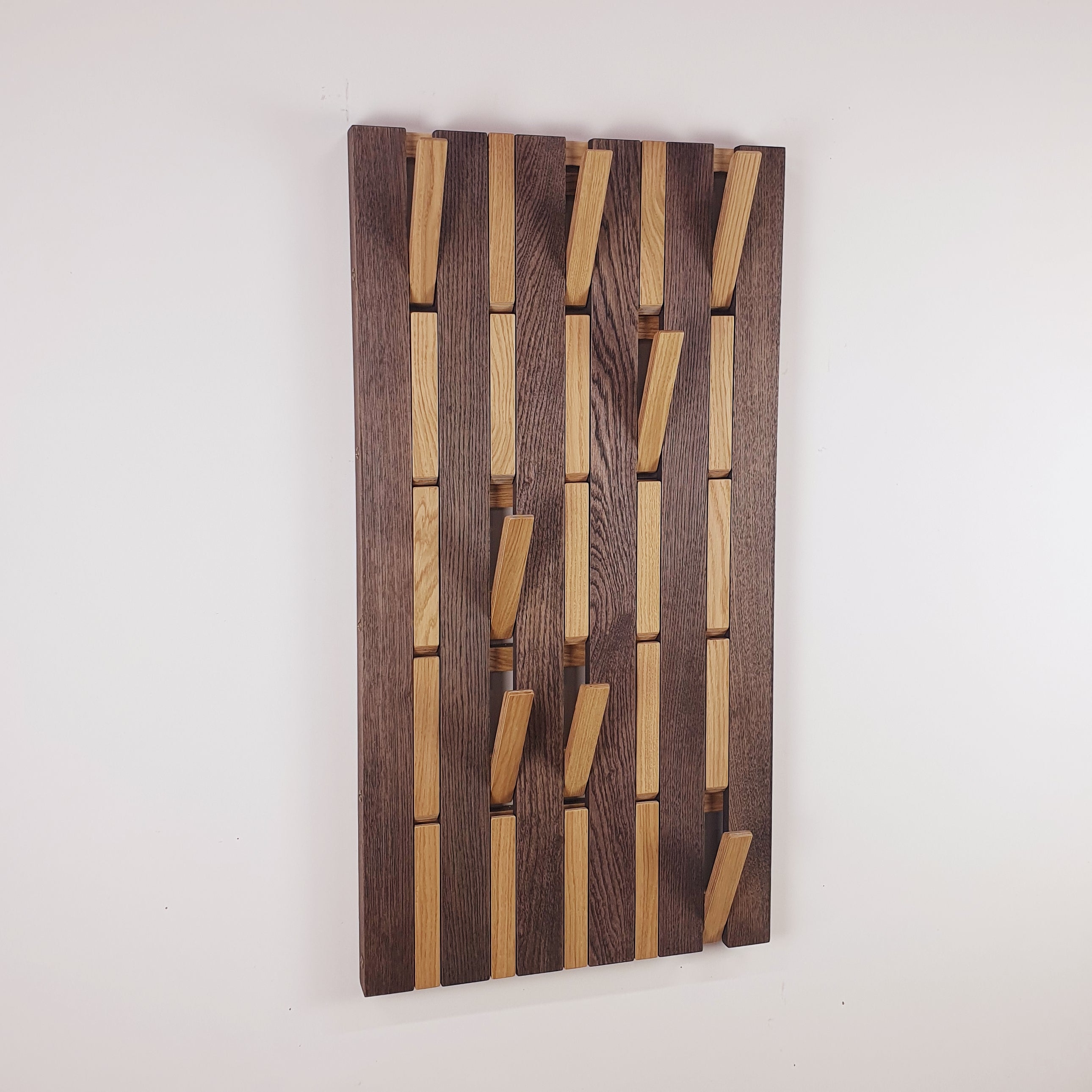 Wall-mounted organizer. light and dark. plywood oak