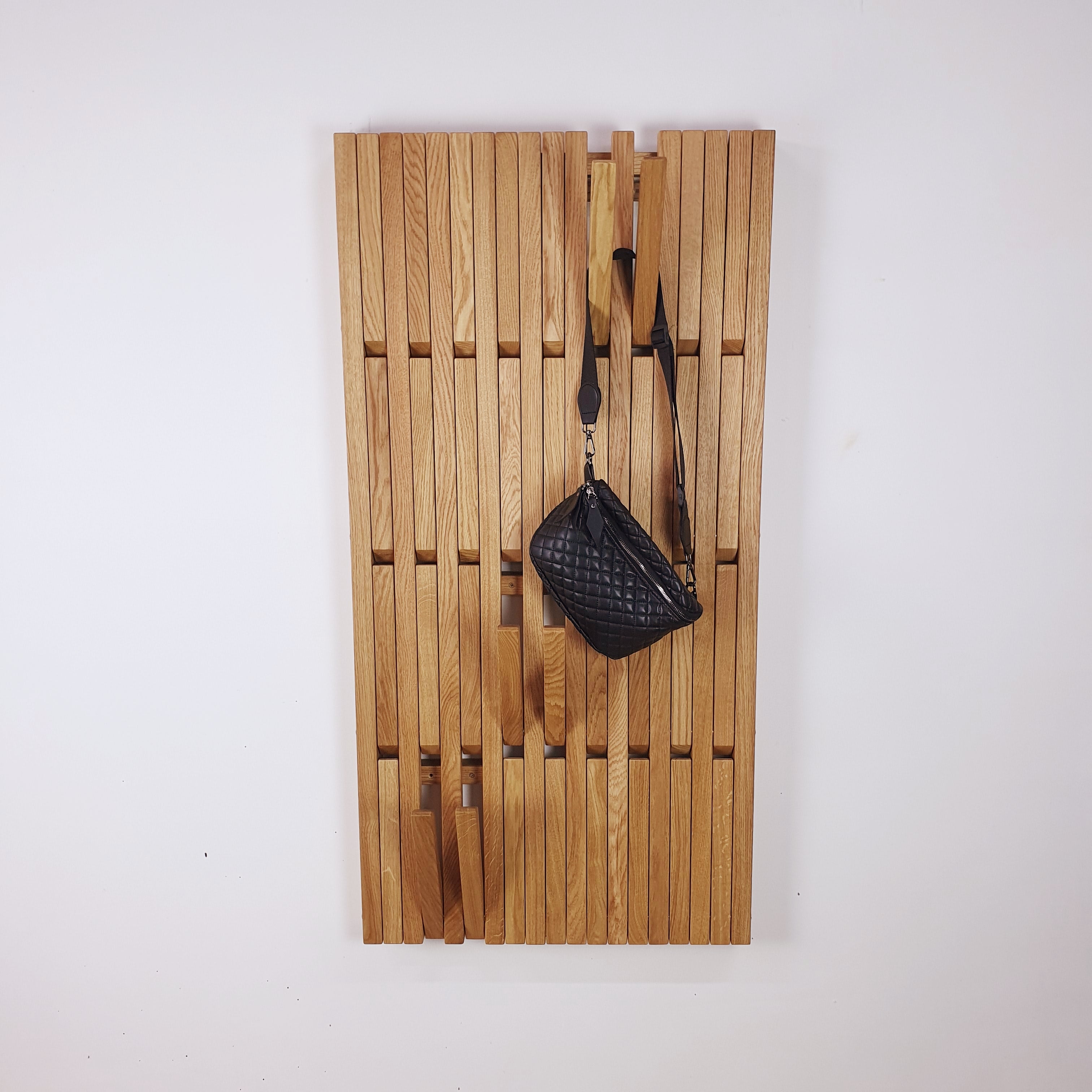Wall-mounted organizer. natural oak